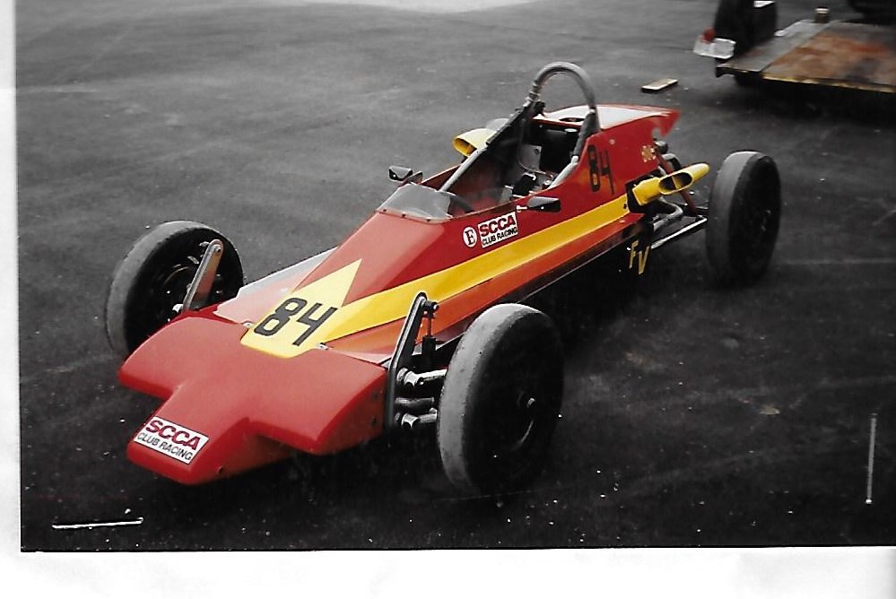 Prototype Z18B built by Ed Zink for Wayne Moore for the '81 RunOffs but wrecked before race, requiring Moore to use his Z12 from the previous years' win. The sister Z18B was built by Steve Lathrop for DRE, who put Curtis Farley in theirs for same RunOffs.<br>
Wayne Moore 1981-4/5/1982<br>
Bill Noble 4/5/1982 for one day <br>
Dave Smith 4/6/1982-7/4/1982 <br>
Dave Schlueter 7/4/1982-??<br>
Dave Smith  ??-9/4/1984 (Lange confirmed purchase from Smith)<br>
Glenn Lange 9/4/1984-8/1987<br>
Paul and Ken Esterly 8/1987-10/11/1991<br>
Paul Epifanio 10/11/1991-12/2/1991<br>
Tim Diebold 12/2/1991-6/30/1996<br>
Sameh Gorgey 6/30/1996-2/16/2008<br>
Matt Kujat 2/16/2008-4/20/2019<br>
Hugh Maloney 4/20/2019-5/5/2021<br>